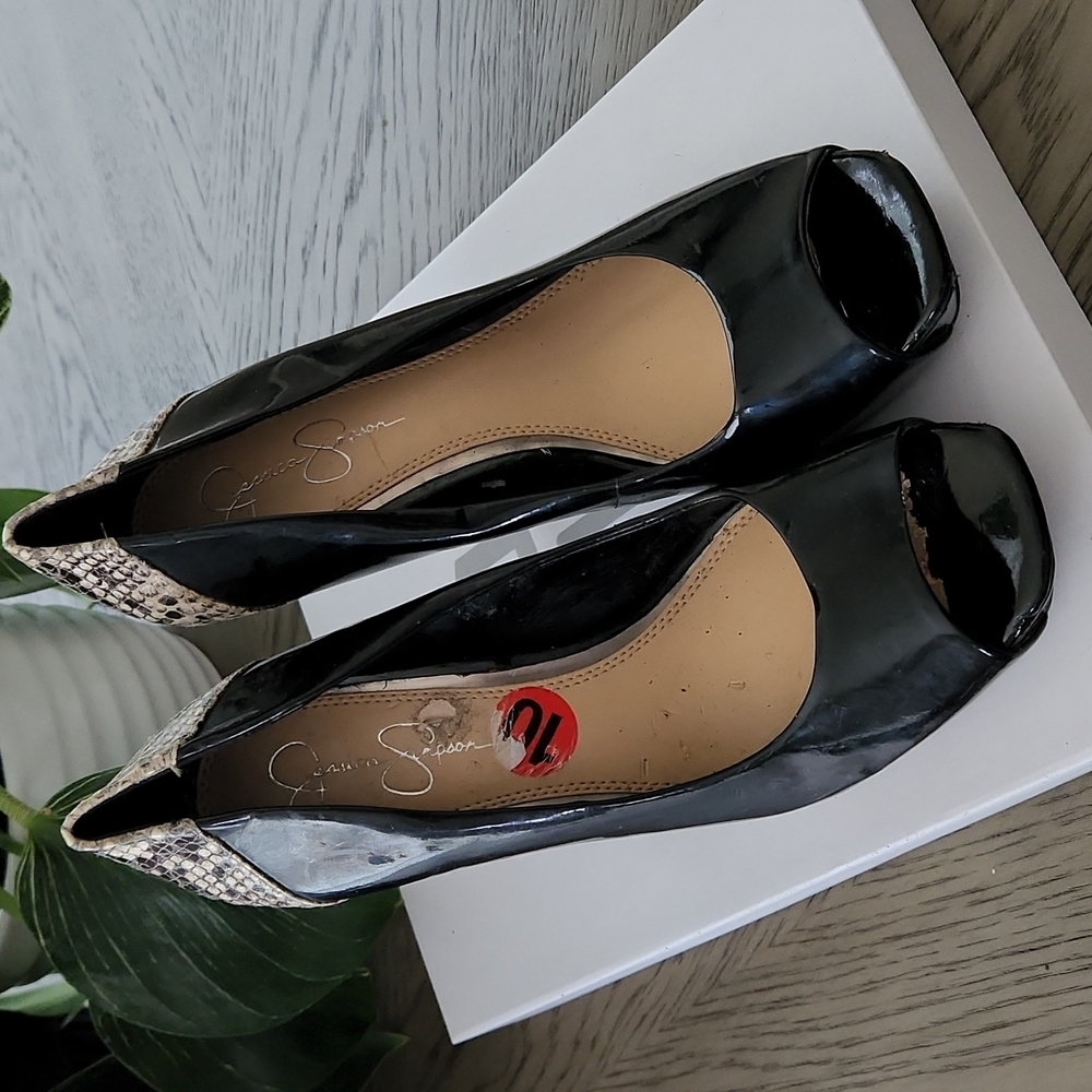 Patent leather and snake print on heels.